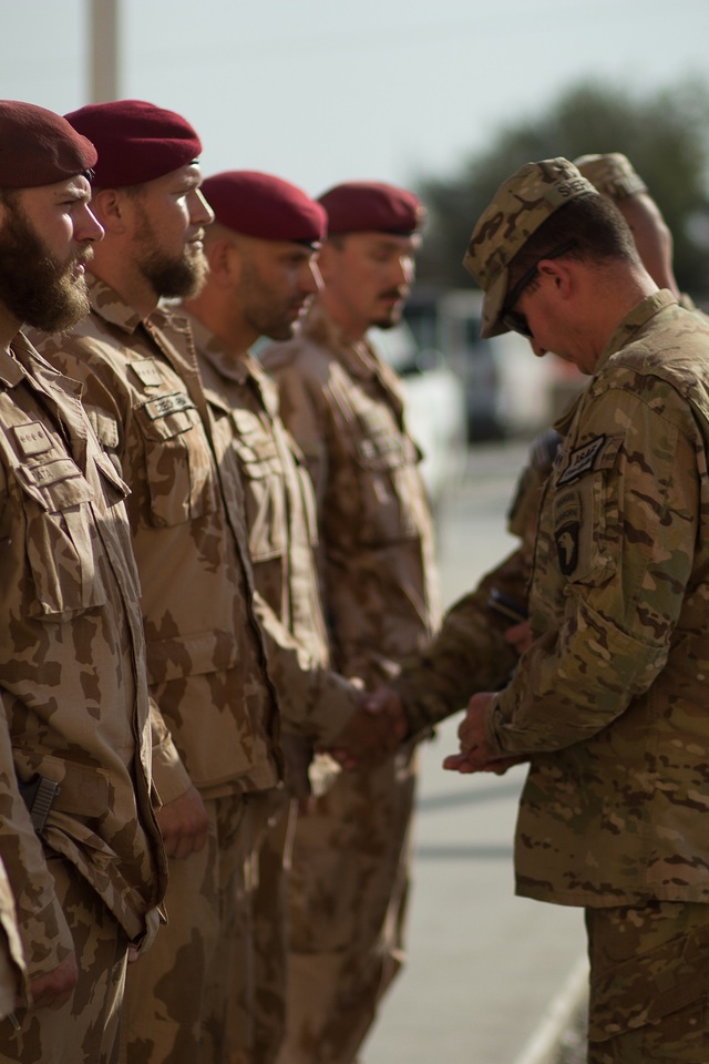 Selected soldiers of the 2nd ACR Guard Company receiving awards from Lieutenant Colonel Mark B. Sherkey, Jr., Commander of the U.S. "Top Guns" Task Force.
