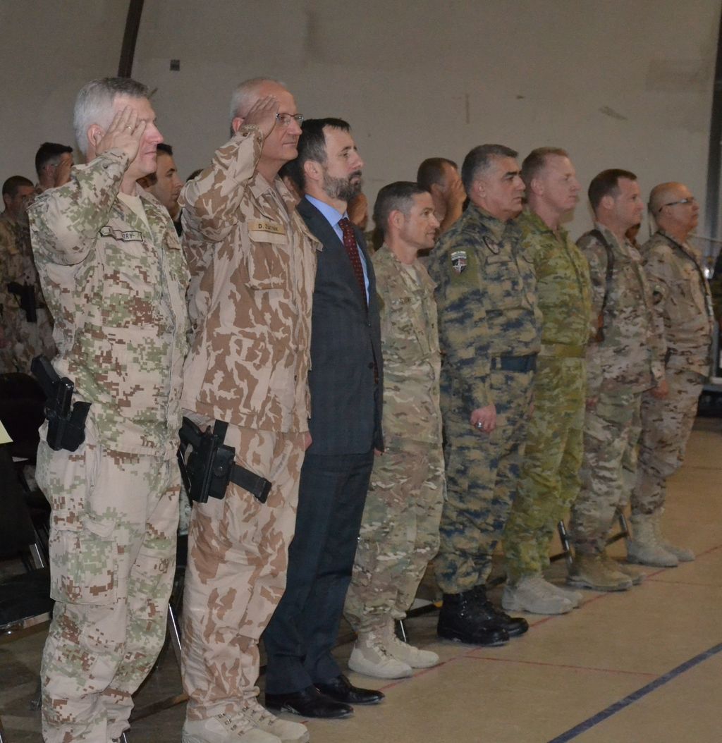 The Ambassador, Slovak and Czech commanders standing for the National Anthems