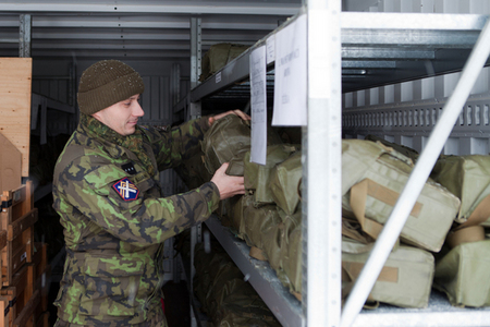 Sergeant Zdenek Sujan dispensing gas masks