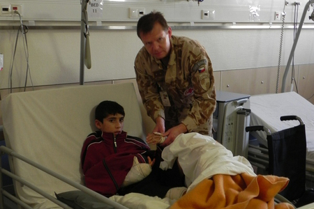 Member of 3rd CST: LTC Dr. Jiri Paral, PhD, assisting a patient in Kabul