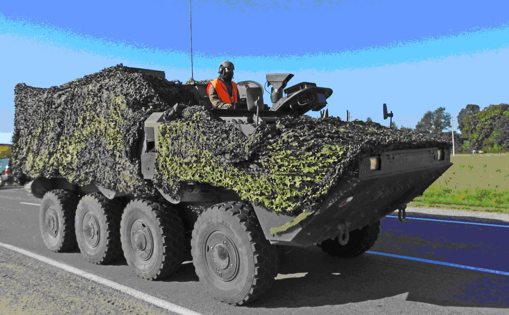 Pandur under camouflage cover travelling to Latvia
