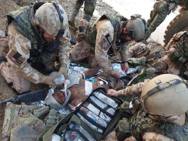 Medics preparing the injured for evacuation