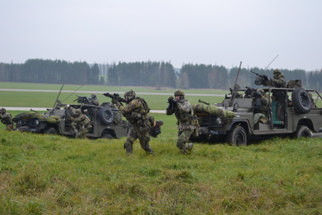 Open space of the airport affords insufficient cover for attacking paratroopers