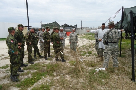 American Military Police explaining procedures at a field prison