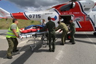 Boarding an injured person into SAR helicopter (July 2012)