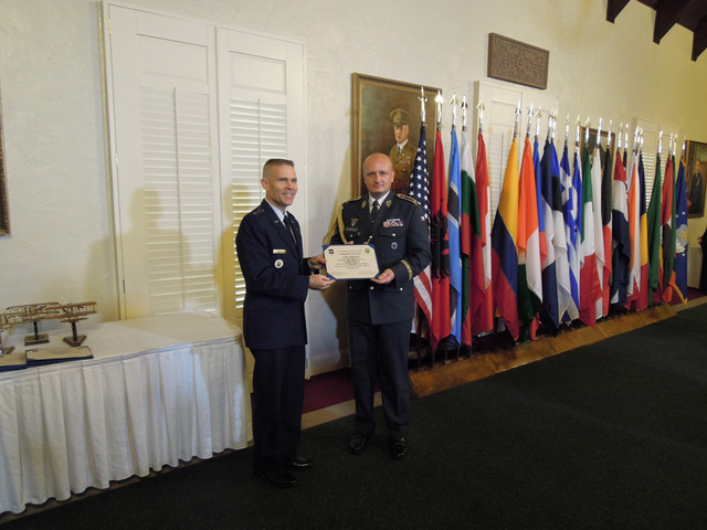 Brigadier General Libor Stefanik receiving his certificate from Lieutenant General Steven L. Kwast, Commander of the Air University