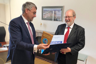 Minister of Defence Lubomír Metnar presents the certificate of appreciation and a plaque on the occasion of the 20th anniversary of accession to NATO to former diplomat Mr. Karel Kovanda, who led the NATO accession talks as a Deputy Minister of Foreign Affairs of the Czech Republic in 1997-98.