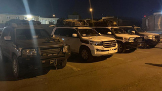 Vehicles of the close protection team of the Military Police, completely full after the evacuation