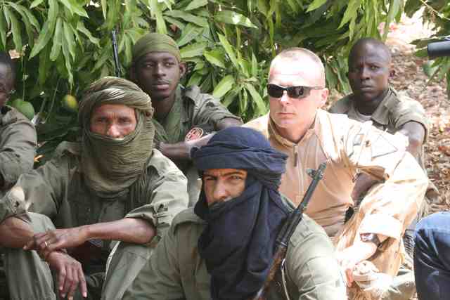 A Czech instructor together with Malian soldiers listening to a lecture on human rights