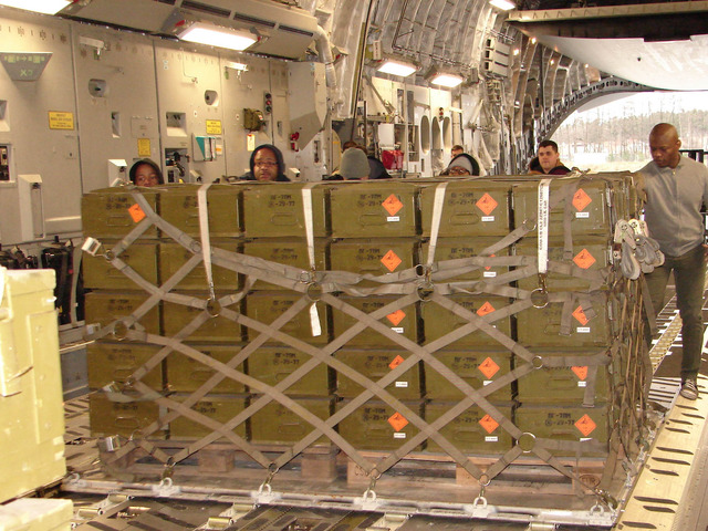 American team handling the palette inside the C-17