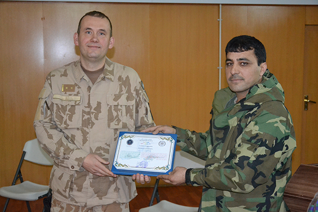 LTC Sliva being presented with a certificate from COL Samim Farid