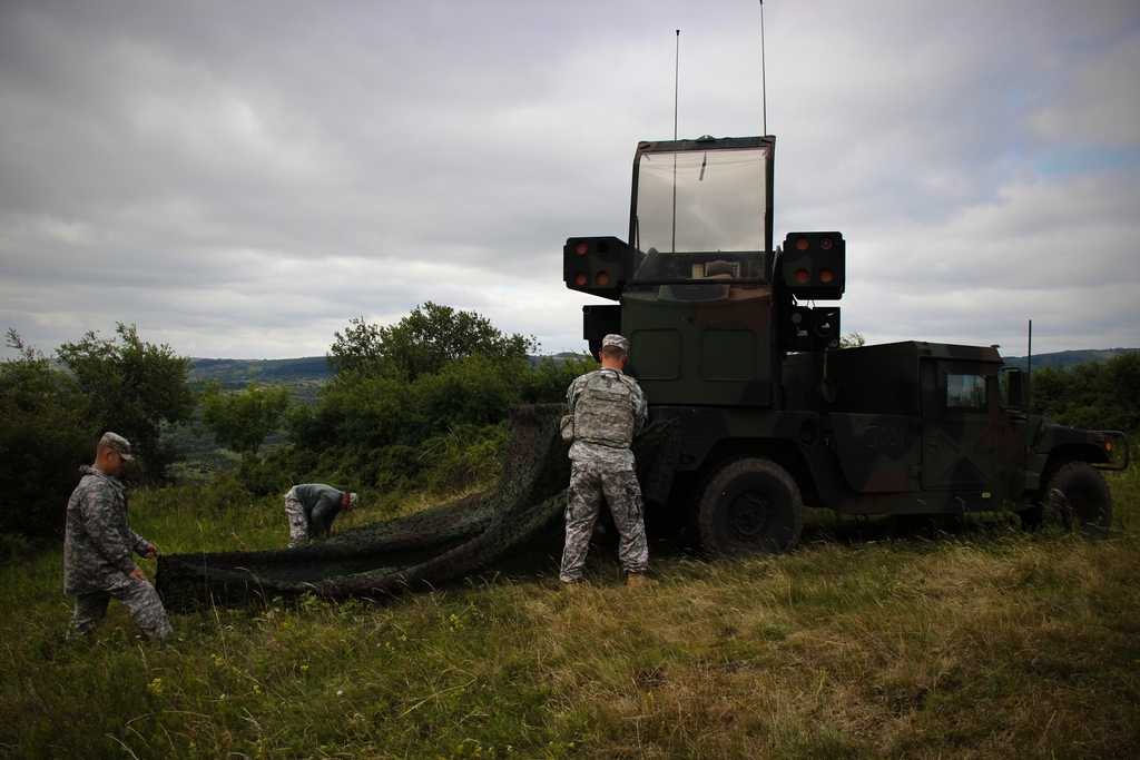 American soldiers preparing their AVENGER air defence system for operation