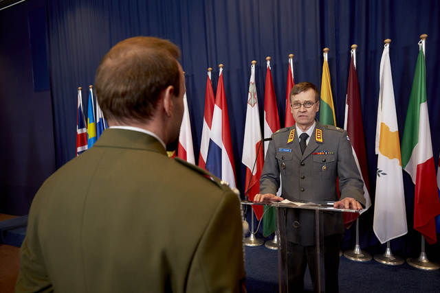 LTG Esa Pulkkinen, Director General of the EU Military Staff, presenting the medal to Corporal C. H. 