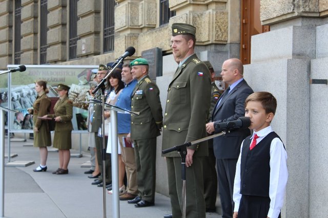 A young singer welcoming guests with a song