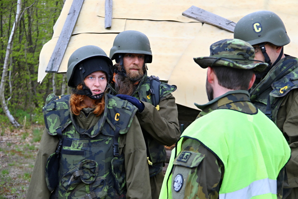 A military instructor explaining further tasks to the trainees