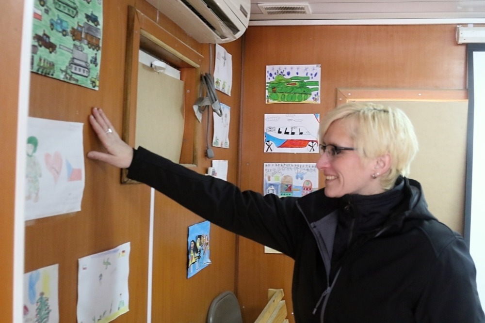 Minister Slechtova looking at pictures sent to the soldiers by Czech children