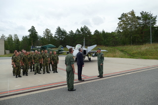A Task Force officer reporting to Minister Metnar 