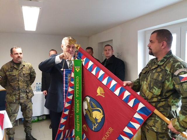 President Zeman attaching the Commemorative Ribbon to the flag of 41st Mechanised Battalion