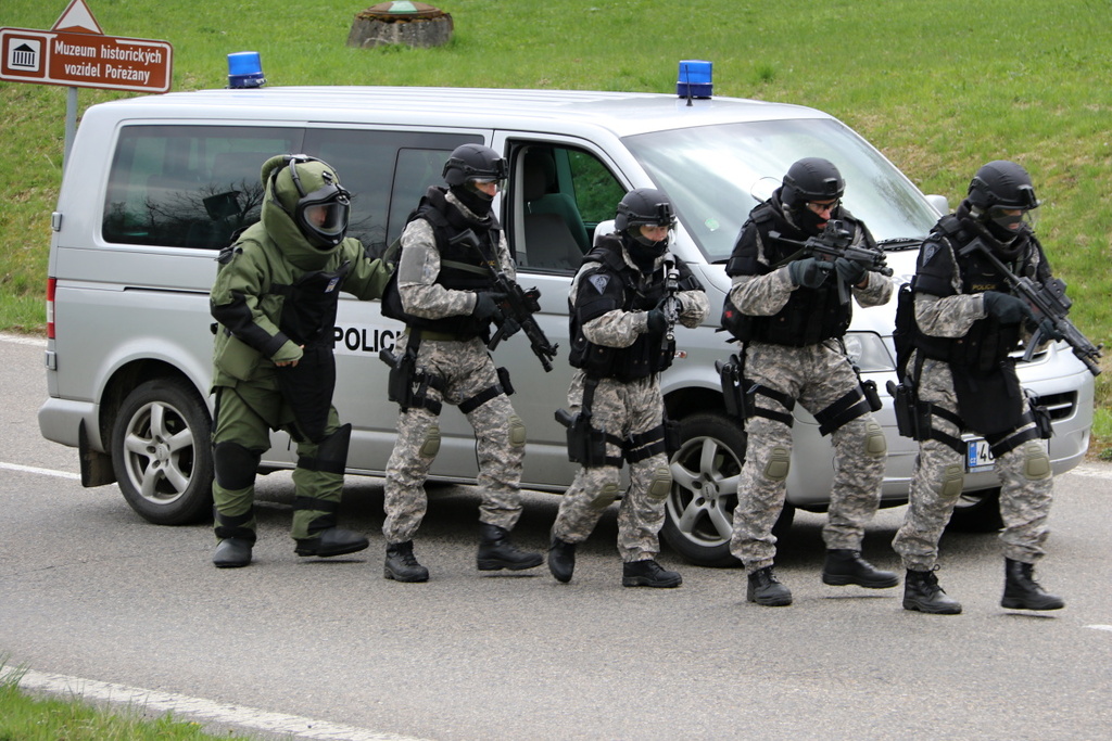 Policemen supported by a bomb squad