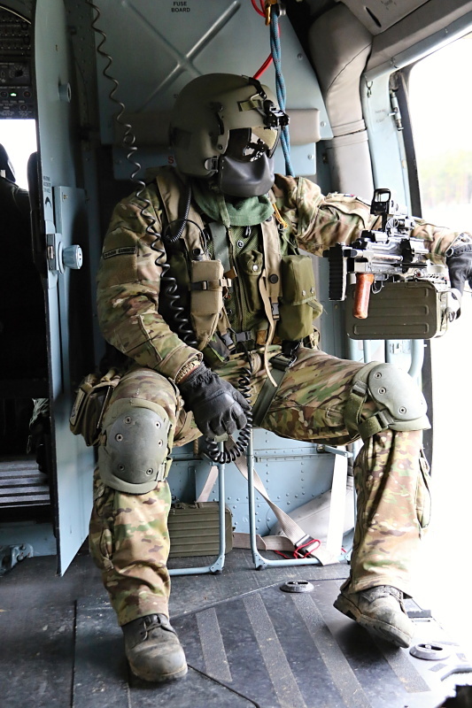 On board gunner monitoring the situation on the ground