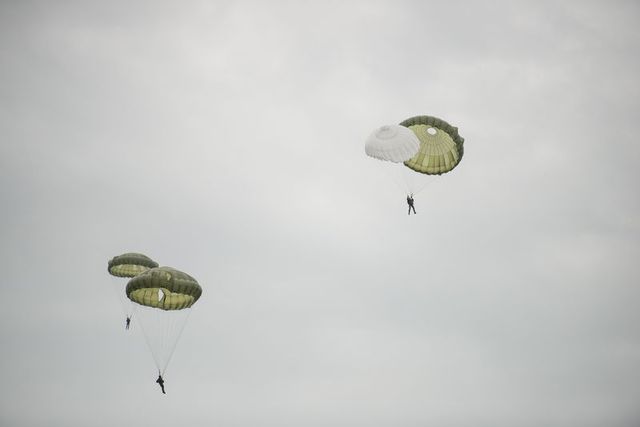 Paratrooper opening his reserve parachute