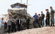 Local officials visit the post